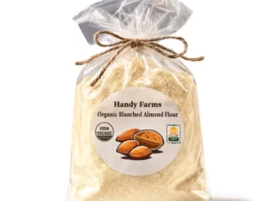 A bag of organic regenerative almond flour with USDA organic certification and a rustic twine bowstring tightened at the head of the bag.