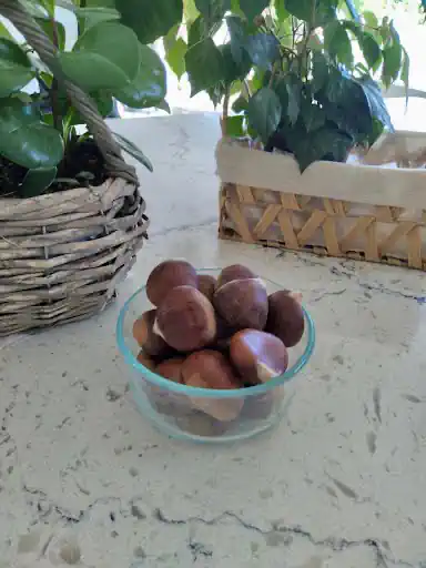 a clear bowl of organic chestnuts