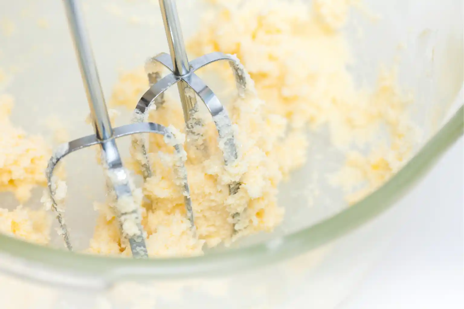 photo of butter mixed with a hand mixer to show pecan praline spice butter recipe